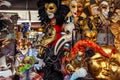 Verona, Italy Ã¢â¬â March 2019. Venetian masks at market in Historic town square Elbe with stairs surrounded by cafes and buildings Royalty Free Stock Photo