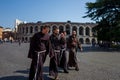 Verona, Italy - October 02: Unknown monks take a walk in front of arena on October 02, 2017 in Verona