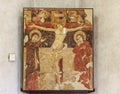 Fragment of a Crucifix painted on the wall at the exhibition in the Castelvecchio Museum of the Castelvecchio Castello Scaligero