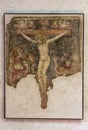 Fragment of a Crucifix painted on the wall at the exhibition in the Castelvecchio Museum of the Castelvecchio Castello Scaligero