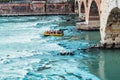 Verona, Italy - September 22, 2021: Hikers go down in an inflatable rafting boat down the river near the city of Verona