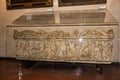 Stone sarcophagus decorated with stone carvings at an exhibition in the Museo Lapidario Maffeiano in Verona, Italy