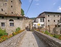 VERRUCOLA, LUNIGIANA, ITALY - AUGUST 12, 2019 - Bridge entrance to Verrucola, picturesque village with its castle