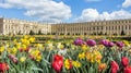 Versailles, France - April, 2012: Gardens of the Versailles in Spring time with colorfu flowers, Palace near Paris, France.