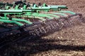 Versatile cultivator with disk, cultivate, harrow tools for secondary tillage - agricultural preparation of soil by mechanical Royalty Free Stock Photo