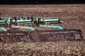 Versatile cultivator with disk, cultivate, harrow tools for secondary tillage - agricultural preparation of soil by mechanical Royalty Free Stock Photo