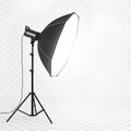 Professional studio softbox light on a tripod stand, illuminating a bright, clean background for photography Royalty Free Stock Photo