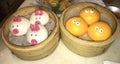 Pretty decorated steamed buns with animal faces.