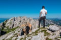 Vertatscha - Hiker man with scenic view of majestic mountain peak Hochstuhl (Stol) in untamed Karawanks Royalty Free Stock Photo