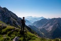 Vertatscha - Hiker man with scenic view of mountain peak Grintovec, majestic Kamnik-Savinja Alps, Slovenia Royalty Free Stock Photo