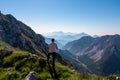 Vertatscha - Hiker man with scenic view of mountain peak Grintovec, majestic Kamnik-Savinja Alps, Slovenia Royalty Free Stock Photo