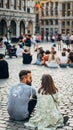 Vertcial shot of people and tourists exploring the cultural city of Brussels, Belgium