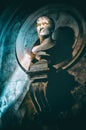 Half-length statue portrait vertical background in the dark with sunray filter through the shadows Royalty Free Stock Photo