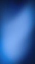 Vertical abstract background with a deep navy and royal blue grainy texture, featuring a smooth gradient and soft light leaks for Royalty Free Stock Photo