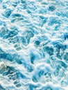 Vertical abstract background. Top down aerial view of sea water surface. White foam waves texture as natural background. Royalty Free Stock Photo