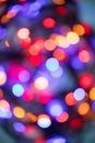 Vertical abstract bokeh background of evening party circle festive lights in red, yellow, blue, violet, orange round circle shape Royalty Free Stock Photo