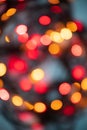 Vertical abstract bokeh background of evening party circle festive lights in red, yellow and orange round circle shape lights. Royalty Free Stock Photo