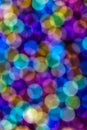 Vertical Abstract Bright Circular Rainbow Colored Blurred Bokeh Background. Unfocused Colorful Texture of Glitter