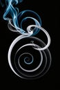Vertical abstract texture black color background with white and blue smoke spiral. Minimalist style, monochrome Royalty Free Stock Photo