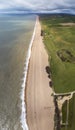 Vertical aerial shot of the beach in Abbotsbury, Dorset, UK taken with a drone Royalty Free Stock Photo