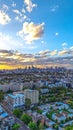 Vertical aerial view of a bright sunset sky over the skyline of Melbourne, Australia