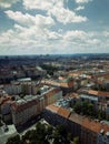 Vertical aerial view of city buildings and streets of Prague under the sunlight