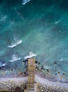 Vertical aerial view of small damaged wooden pier on the black Sea