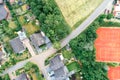 Vertical aerial view of a suburban settlement in Germany with detached houses, close neighbourhood and gardens in front of the hou