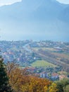 Vertical aerial view of a town on the background of the rocky hills on a sunny day