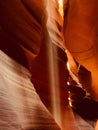 Vertical amazing shot of an inside  view of  Antelope Canyon with sandstones and sunlight in Royalty Free Stock Photo