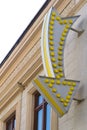 Vertical arrow sign with light bulbs