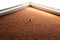 Vertical aspect of the recent brick built home exterior.