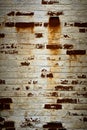 Vertical background or backdrop of an old brick wall covered with grayed peeling white paint Royalty Free Stock Photo