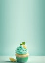 vanilla cupcake with mint cream and lemon, citrus dessert, homemade pastries, lemon slice, place for text Royalty Free Stock Photo