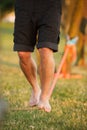 Vertical barefoot person walking on a slackline, slacklining in the daytime, the concept of balance Royalty Free Stock Photo