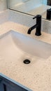 Vertical Bathroom white countertop with single basin undermount sink and black faucet