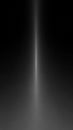 Vertical beam of bright white light emanating from a dark, diffused background creating a dramatic spotlight or energy effect Royalty Free Stock Photo
