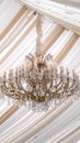 Vertical Beautiful chandelier with crystals and faux candles at a wedding venue