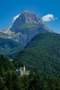 VERTICAL: Beautiful forest covered mountains surround a World War I stronghold.