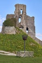 Vertical beautiful shot of the ruins of Corfe Castle under the blue sky