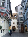 Vertical beautiful urban scenery of people walking down a street, city life in Zurich, Switzerland