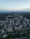 Vertical bird-eyes view of a modern city with skyscrapers on an evening Royalty Free Stock Photo