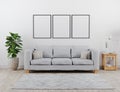 Vertical black poster frame mock up. Modern living room with grey sofa mockup. scandinavian style, cozy and stylish interior Royalty Free Stock Photo