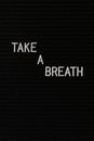 Vertical black spongy board with a text "take a breath" for background
