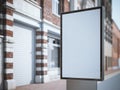 Vertical blank billboard on the city street with classic buildings. Royalty Free Stock Photo