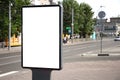 Vertical blank billboard. Mockup of outdoor advertising with copy space on the city street sidewalk Royalty Free Stock Photo