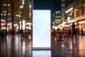 Vertical blank white advertising billboard on the evening street, banner frame for advertisement and information Royalty Free Stock Photo