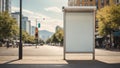 Vertical blank white billboard at bus stop on city street. In the background buildings and road. Mock up. Poster on street next to Royalty Free Stock Photo