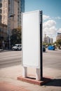 Vertical blank white billboard at bus stop on city street. In the background buildings and road. Mock up. Poster on street next to Royalty Free Stock Photo