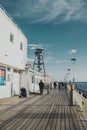 Vertical of the Bournemouth beach pier with visitors on a sunny day